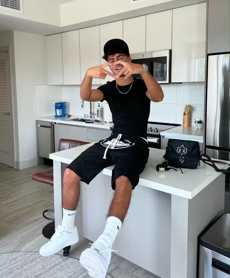 Black tee with Corteiz shorts