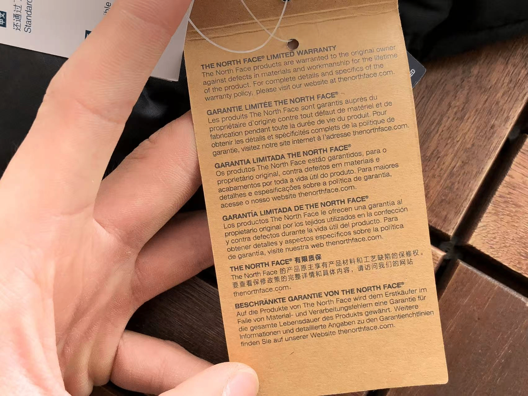 North Face limited warranty hang tag
